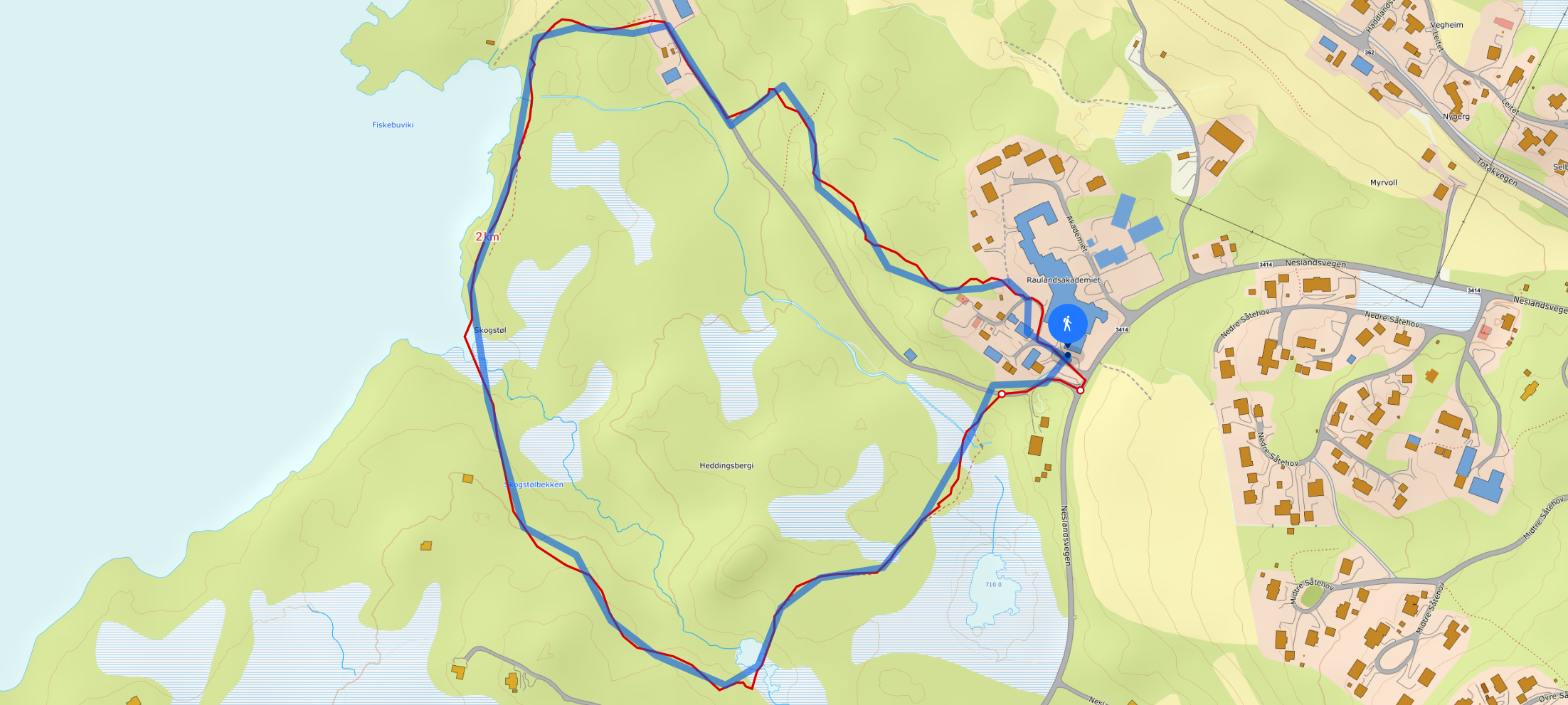 Kart over tursti ved Raulandsakademiet, viser rute rundt fiskevann og boligområde.